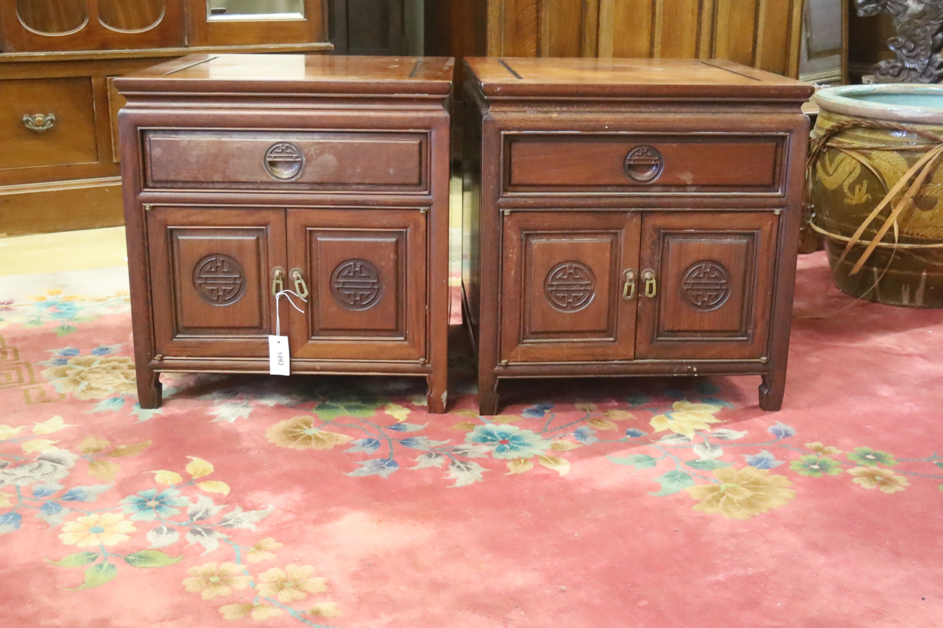 A pair of Chinese carved hardwood low cabinets, width 56cm, depth 56cm, height 59cm
